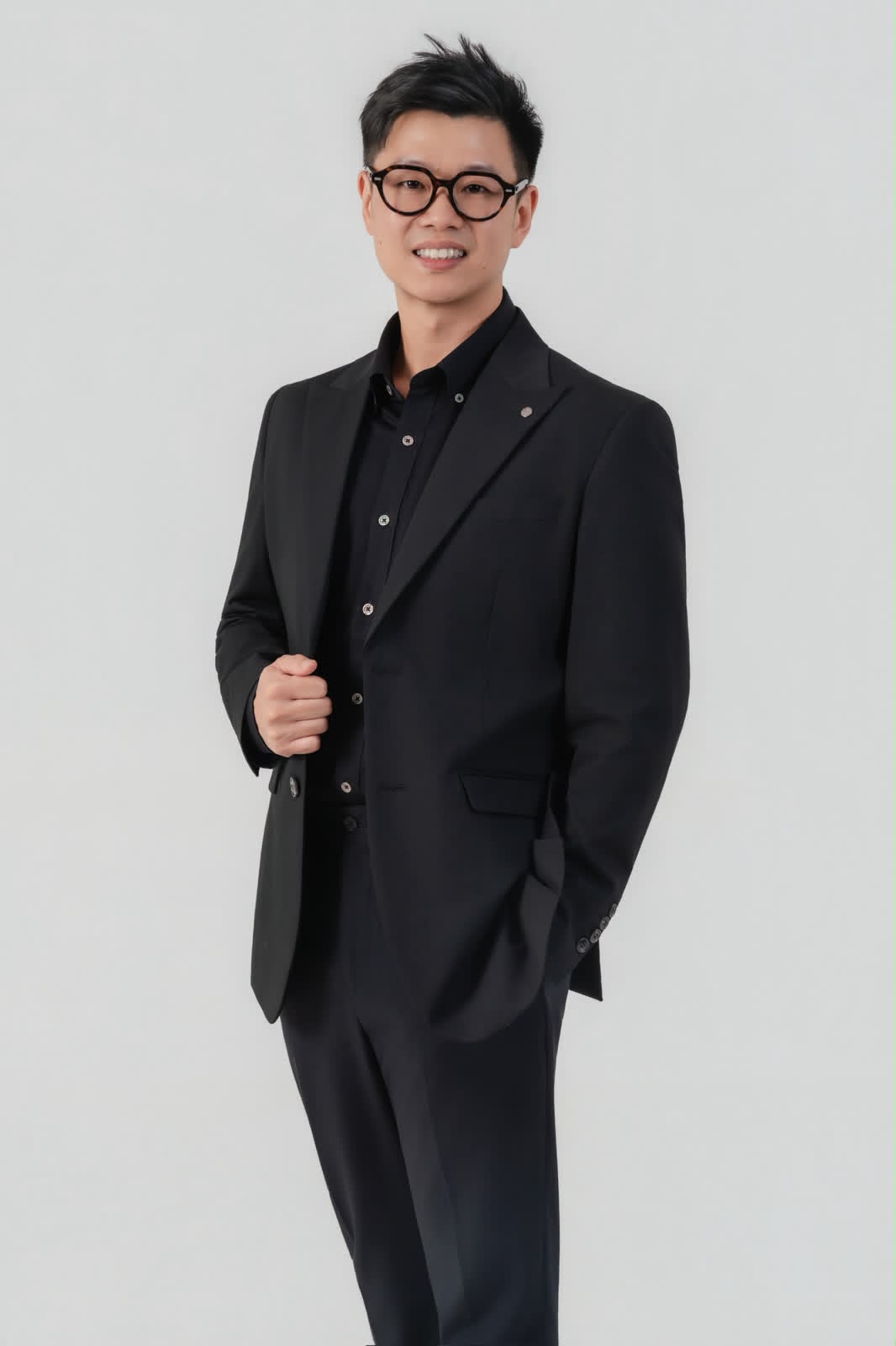 Danny Chua, Financial Consultant, standing confidently in a bright studio setting